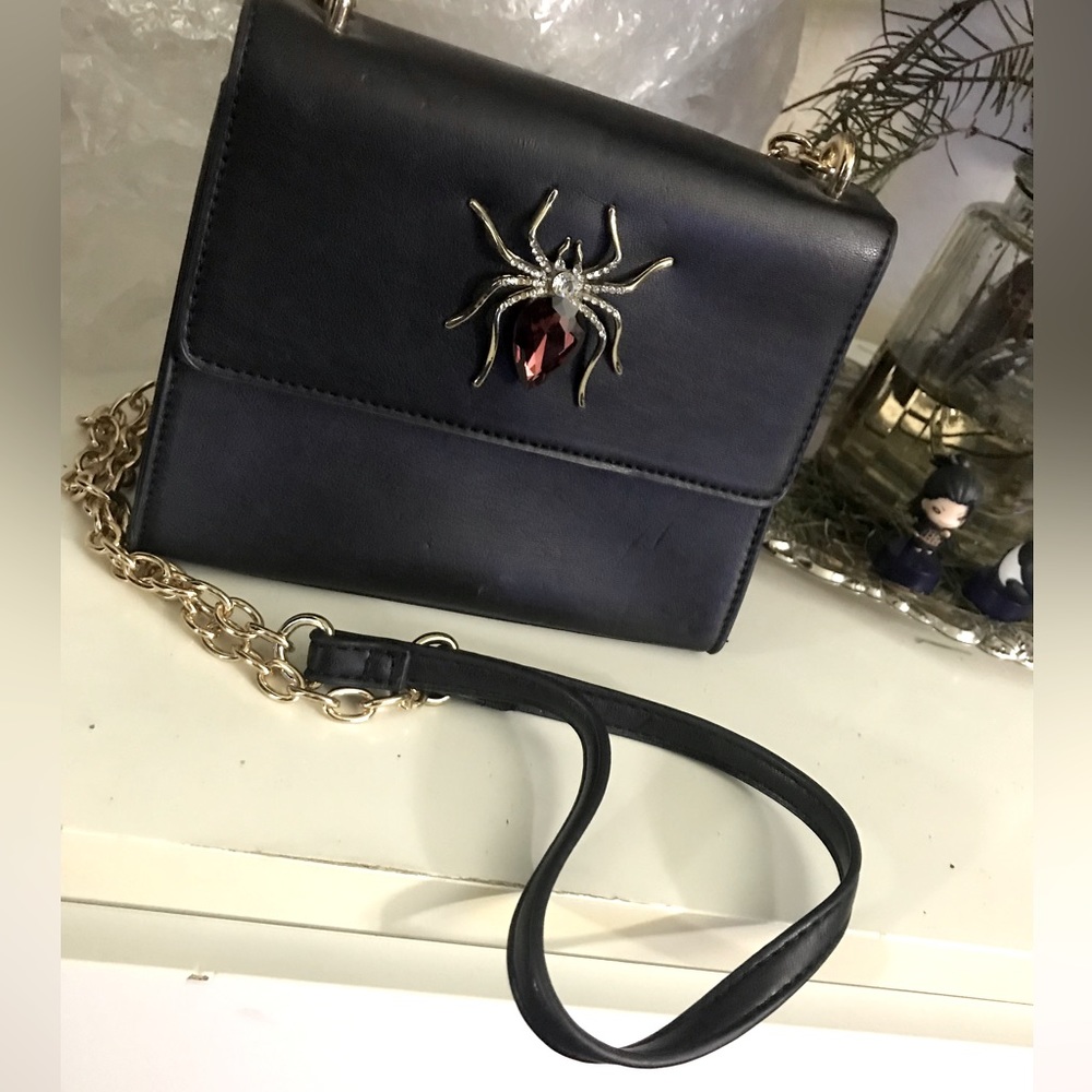 Spider purse with purple gem